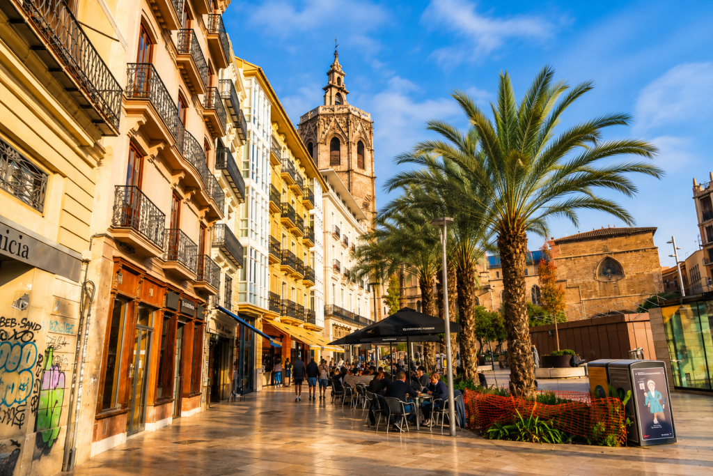 Valencia Old Town street with palm trees and historic architecture