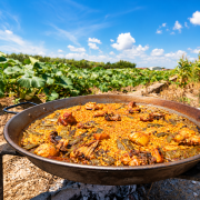 Traditional Paella Valenciana cooked outdoors in Valencia
